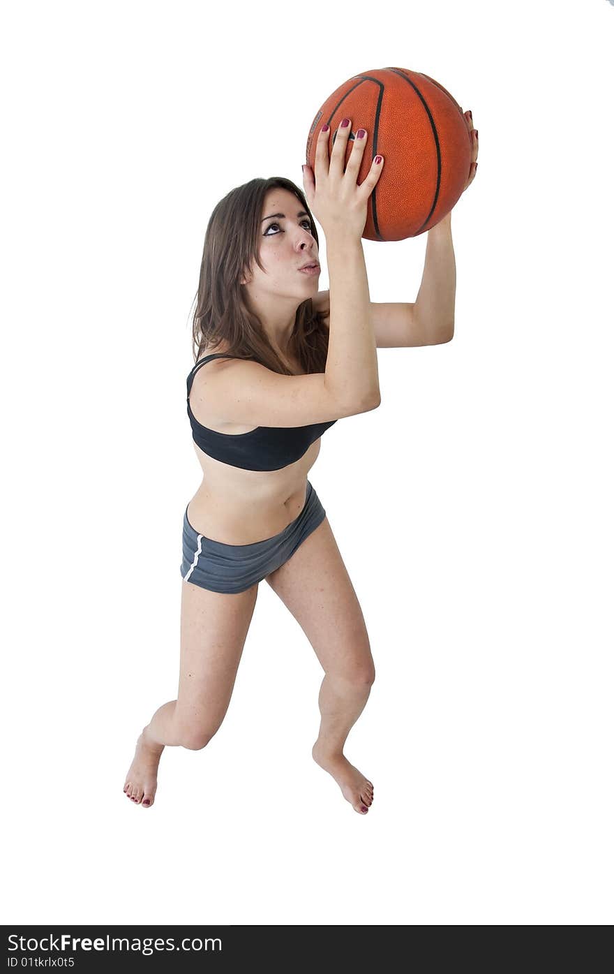 Young cute woman playing basketball