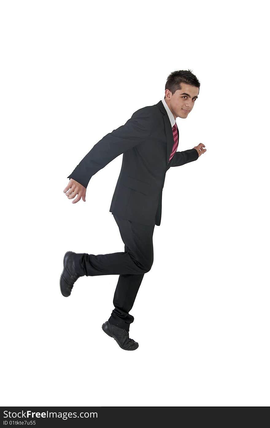 An young businessman in running position. An young businessman in running position