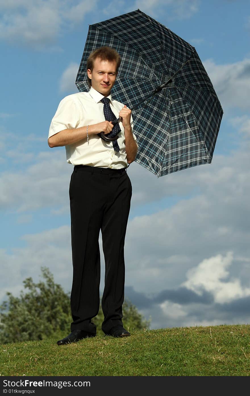 Businessman Holding Umbrella