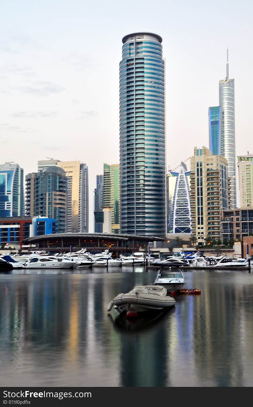 Luxury Yachts in Dubai Marina with waterfront Apartments in the background. Luxury Yachts in Dubai Marina with waterfront Apartments in the background