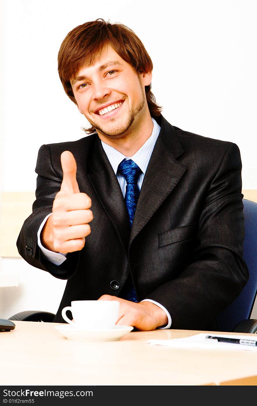 Successful businessman showing thumbs up. Successful businessman showing thumbs up