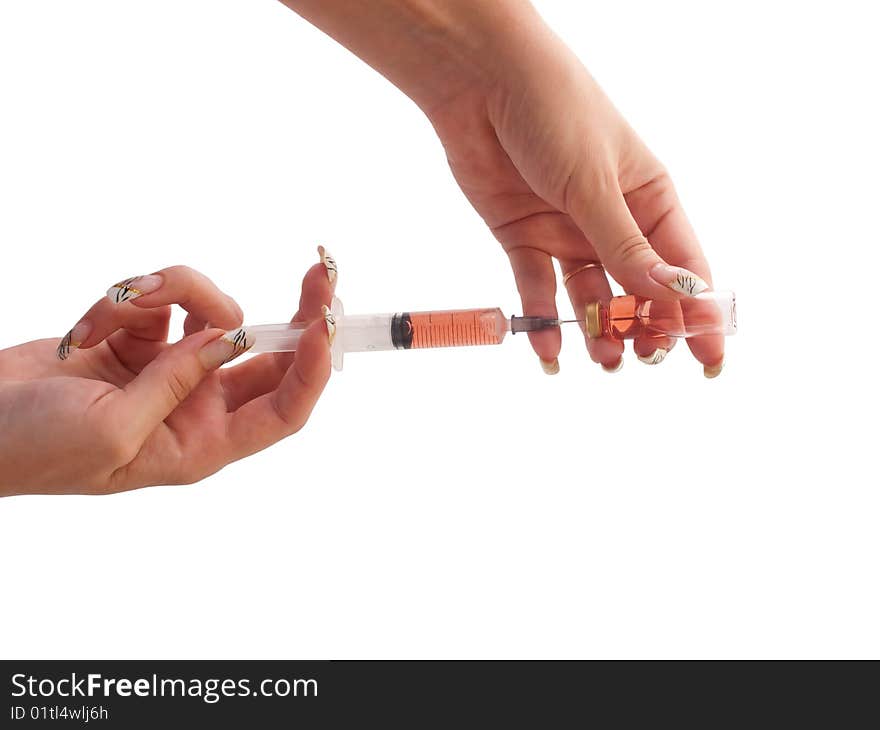 Filled syringe in a woman hands.