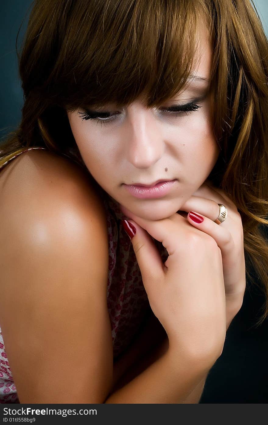 Portrait of pensive girl who looks down