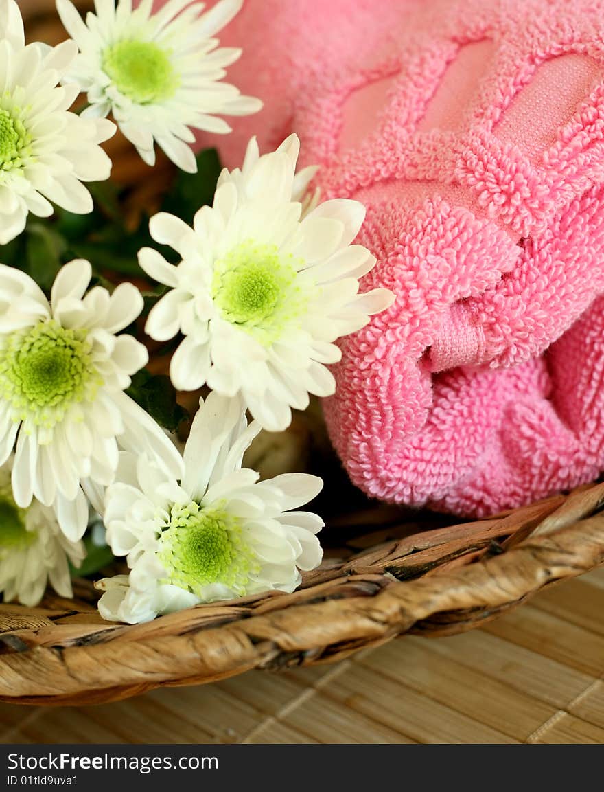 Towel and flowers - beauty treatment