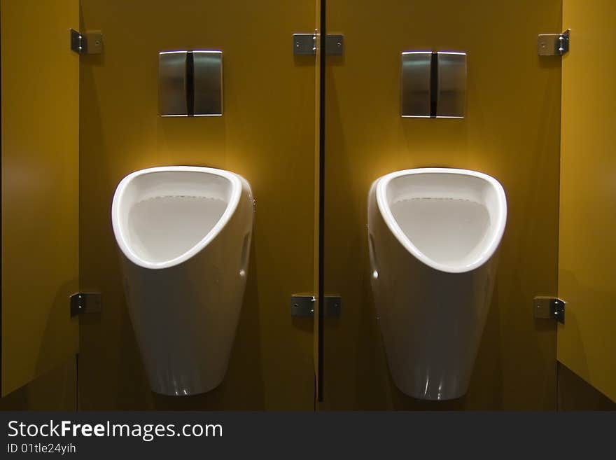 Two urinals in a public restroom