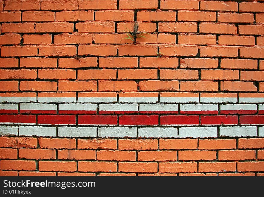 Orange brick wall and red white line