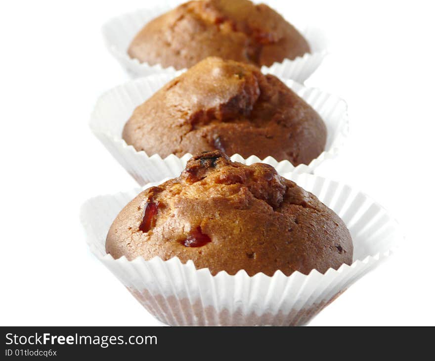 Fruit cupcakes isolated over white background. Shallow dof.