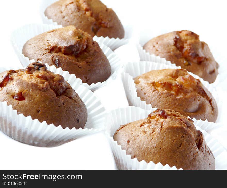 Fruit cupcakes isolated over white background. Shallow dof.