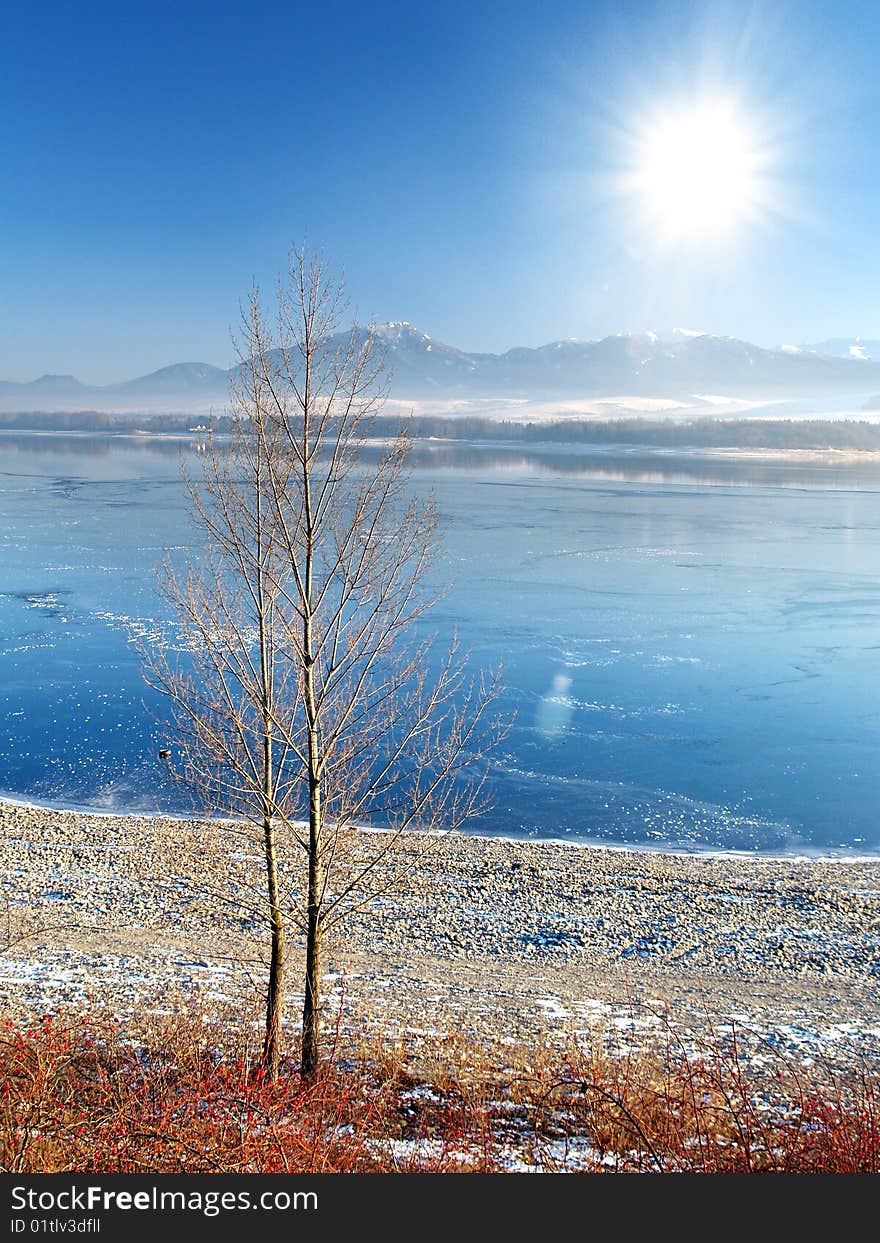 A view of the frozen lake and the sun.