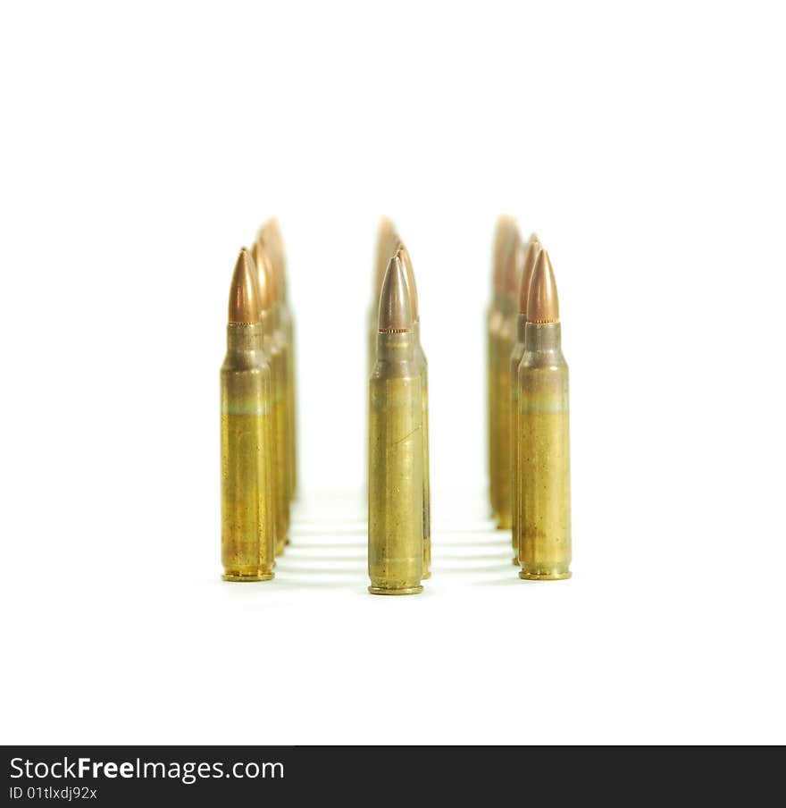 Three rows of gun bullets over white. Three rows of gun bullets over white