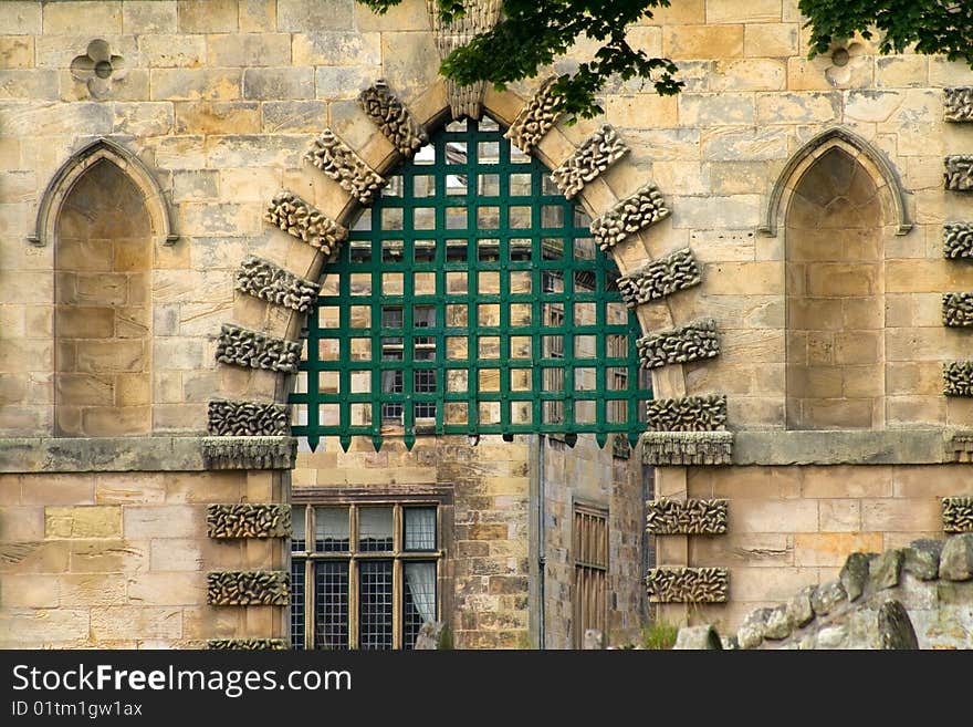 A gated stone entrance doorway in Ford Castle, Northumberland. A gated stone entrance doorway in Ford Castle, Northumberland