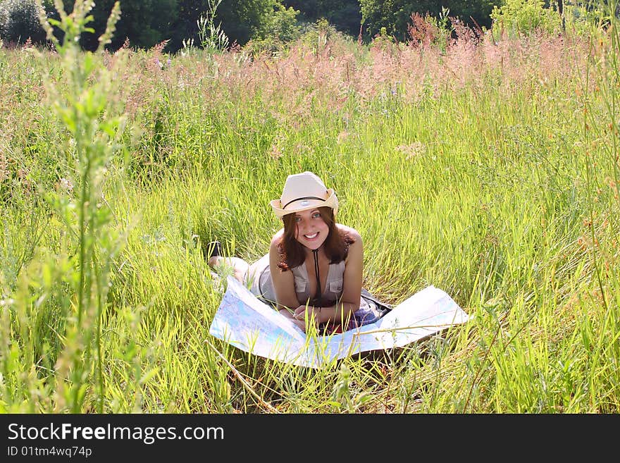 The Girl On Summer Meadow With Topographic Map