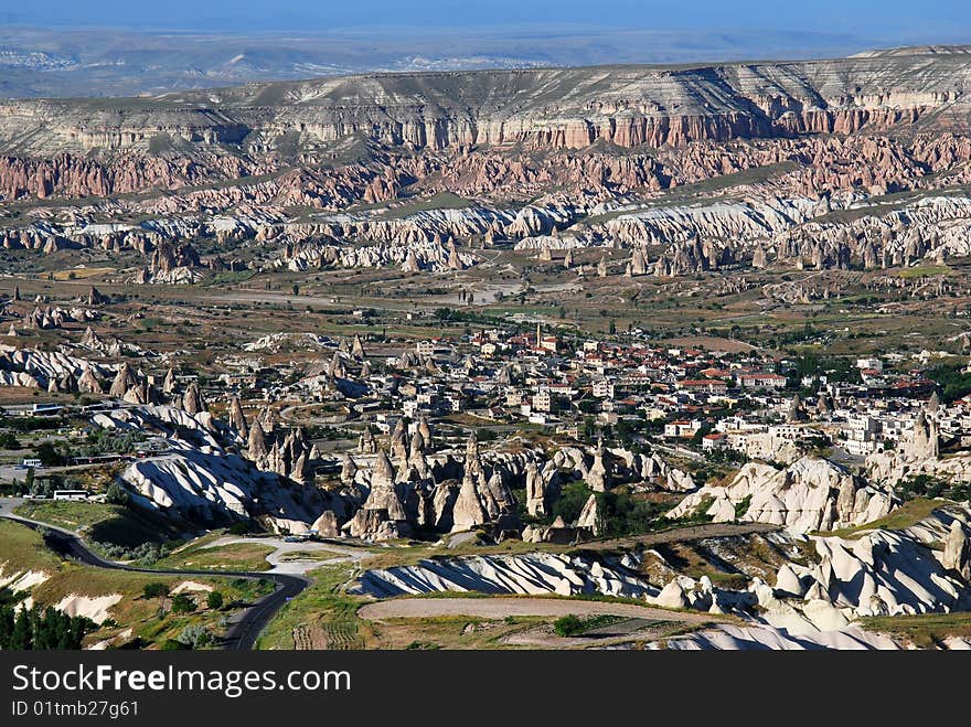 Goreme is a town in the Cappadocia region of Turkey. The town is centered in the middle of a internationally popular region that is best known for its natural rock formations, often called fairy chimneys. Goreme is a town in the Cappadocia region of Turkey. The town is centered in the middle of a internationally popular region that is best known for its natural rock formations, often called fairy chimneys.