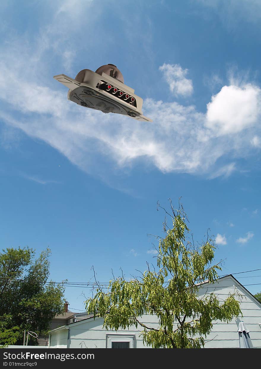 UFO scout ship hovering over a house.