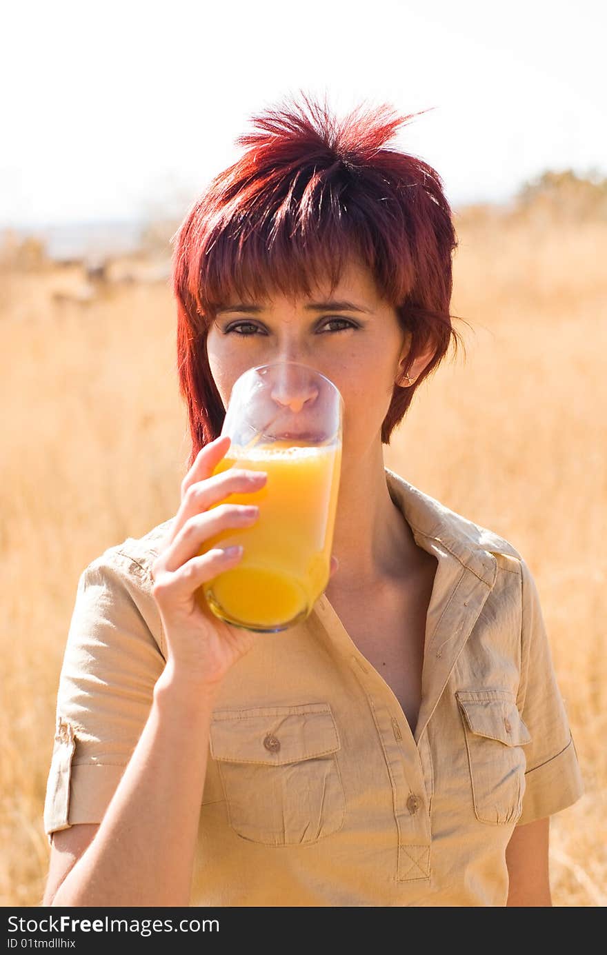 WOMAN DRINKS ORANGE JUICE