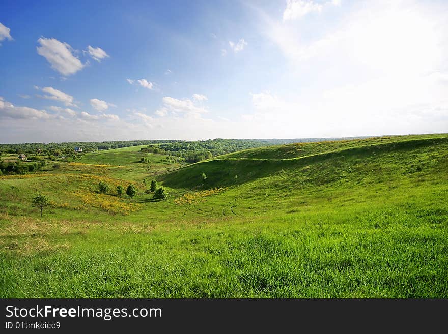 Spring hills landscape with sun backlight. Spring hills landscape with sun backlight