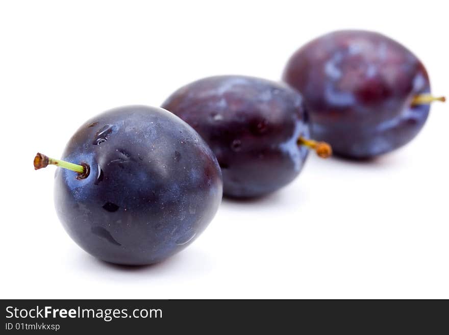 Plums on a white Plate