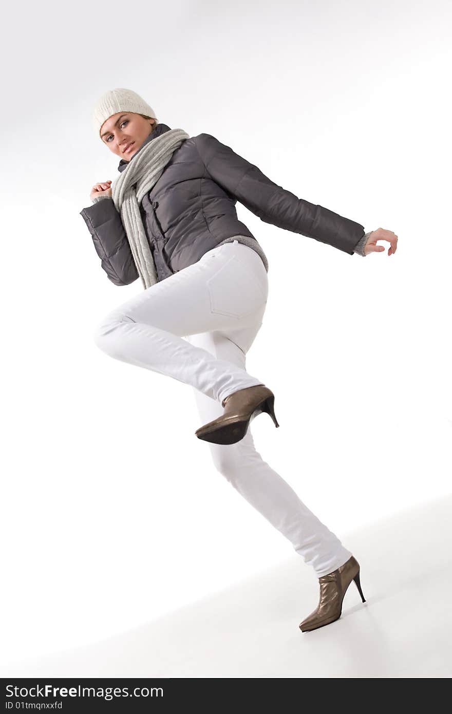 Young lady dressed winter clothes over white