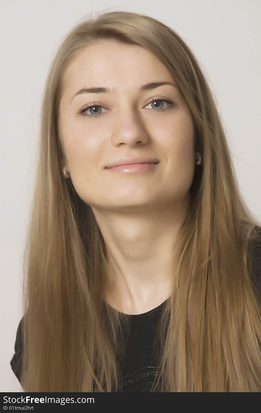 Young sexual girl blonde portrait in a studio on a white background