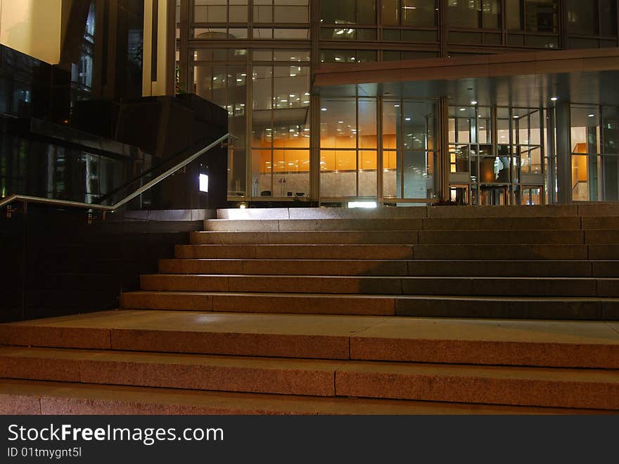 Concrete steps leading to the entrance door of a modern office building downtown Montreal. Concrete steps leading to the entrance door of a modern office building downtown Montreal