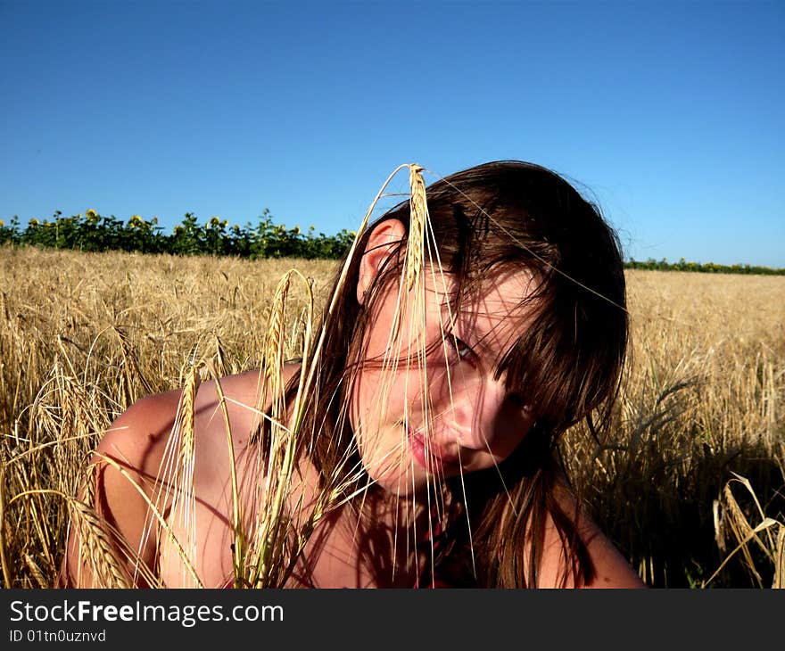 Young girl  with weath on nature