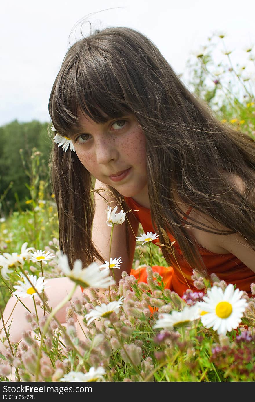 The portrait  of girl in the middle of flower