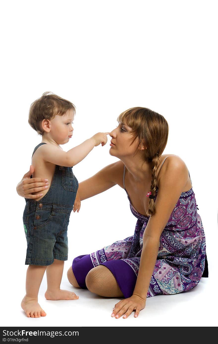 Young caucasian woman playing with baby boy. Young caucasian woman playing with baby boy