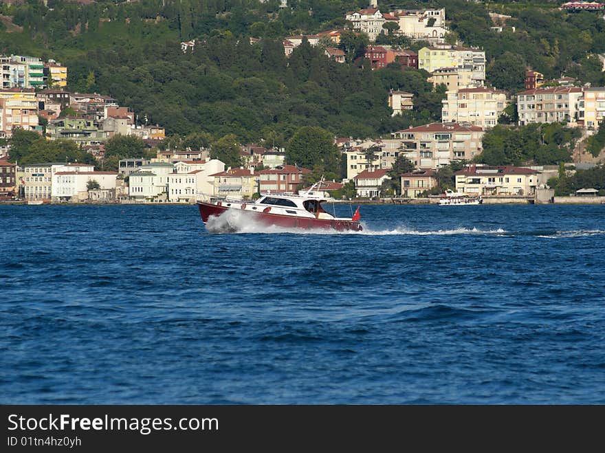 Classical powerboat passing through Straits of Bhosporus. Istanbul. Turkey