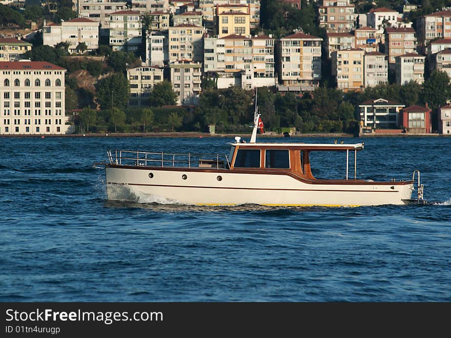 Classical powerboat passing through Straits of Bhosporus. Istanbul. Turkey