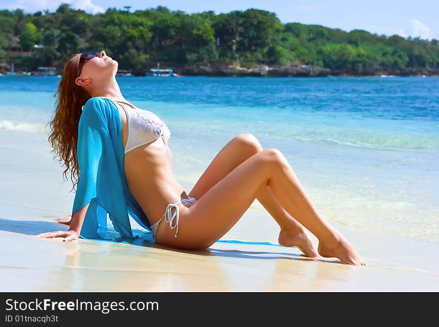 Brunette girl relaxing on the beach