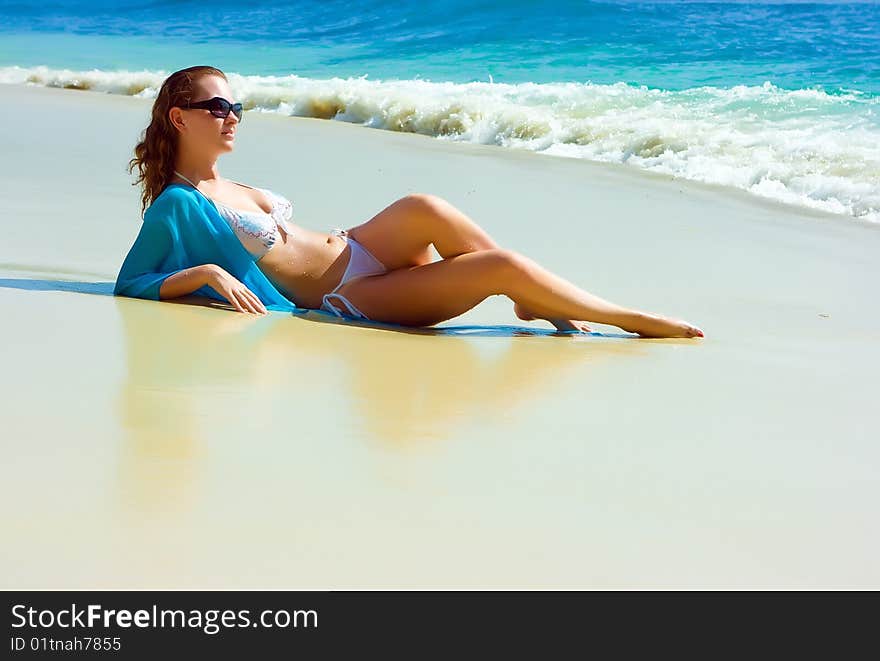 Brunette girl relaxing on the beach