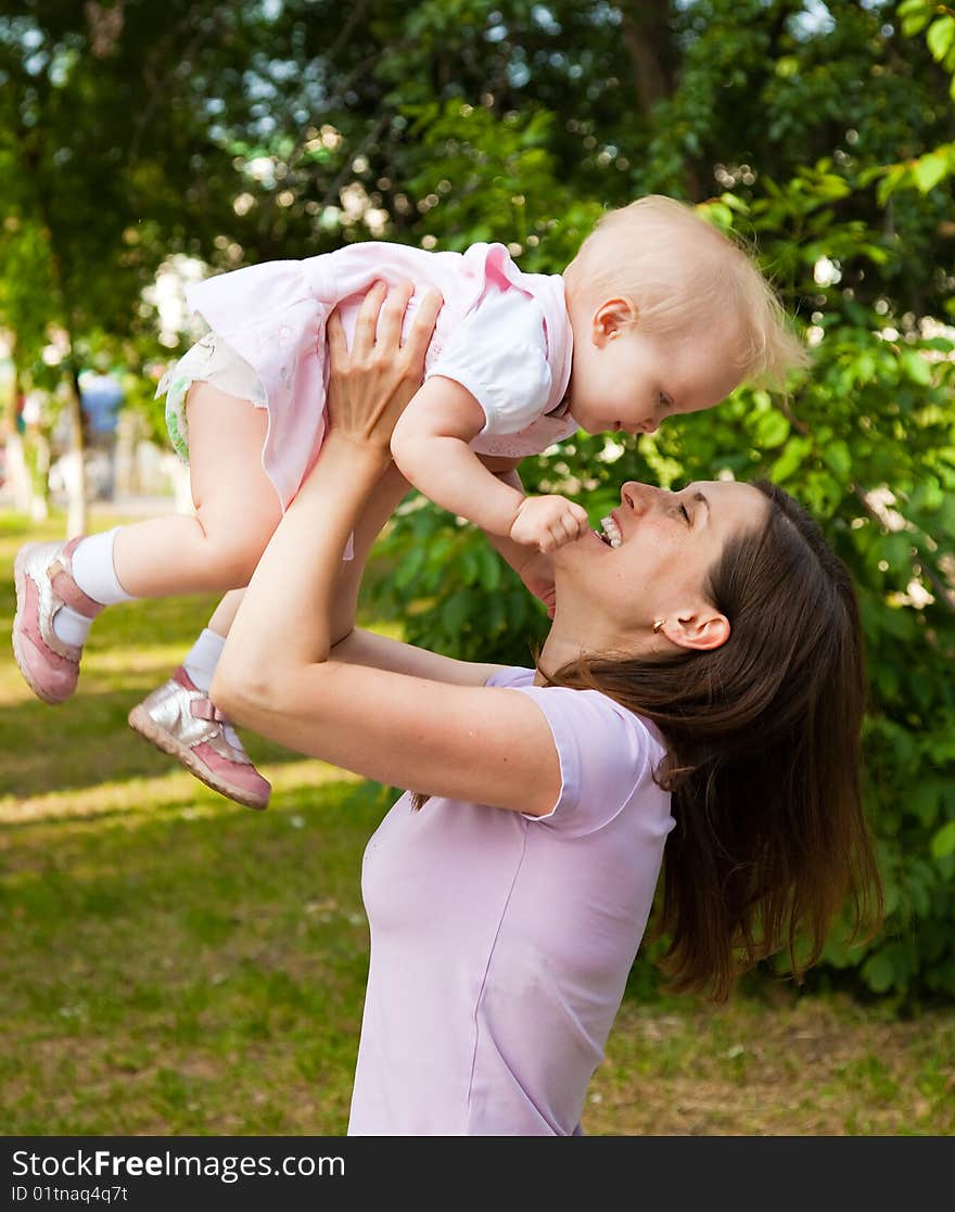 Woman holding her one year old daughter. Woman holding her one year old daughter