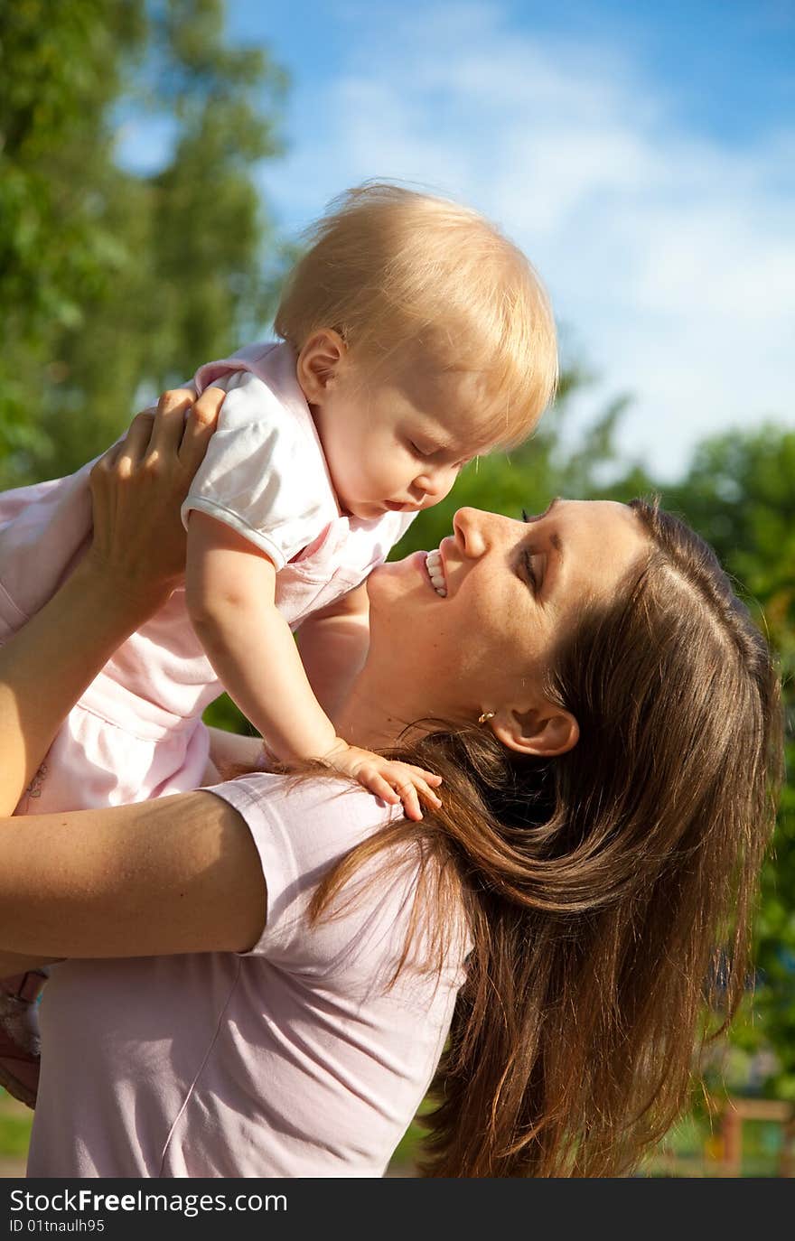 Woman holding her one year old daughter. Woman holding her one year old daughter