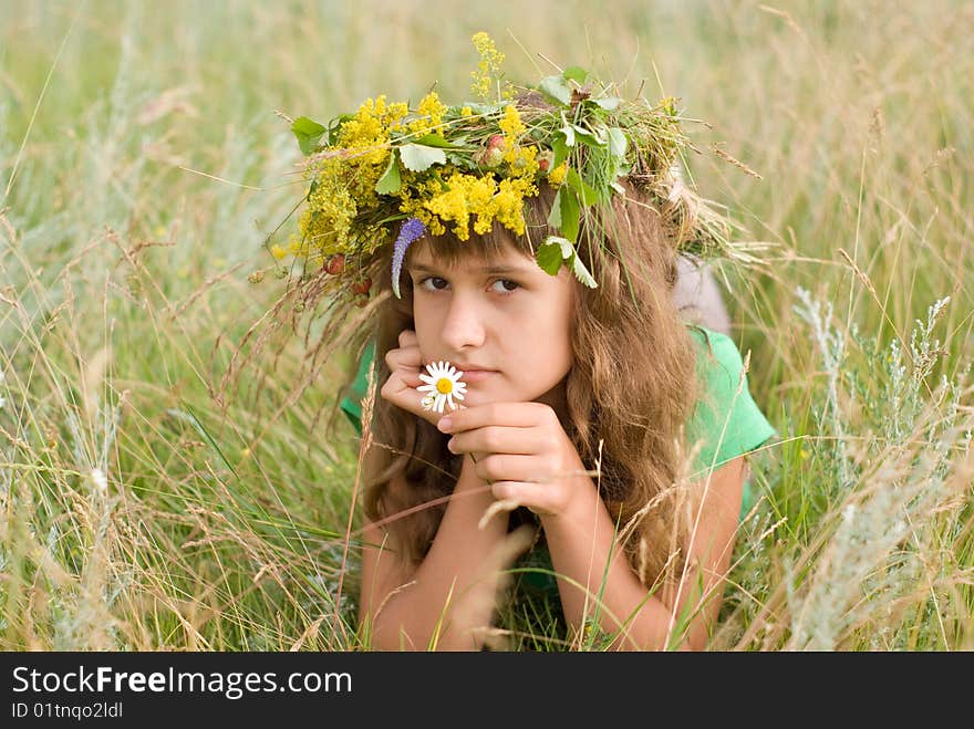 A young girl lies on a meadow. A young girl lies on a meadow