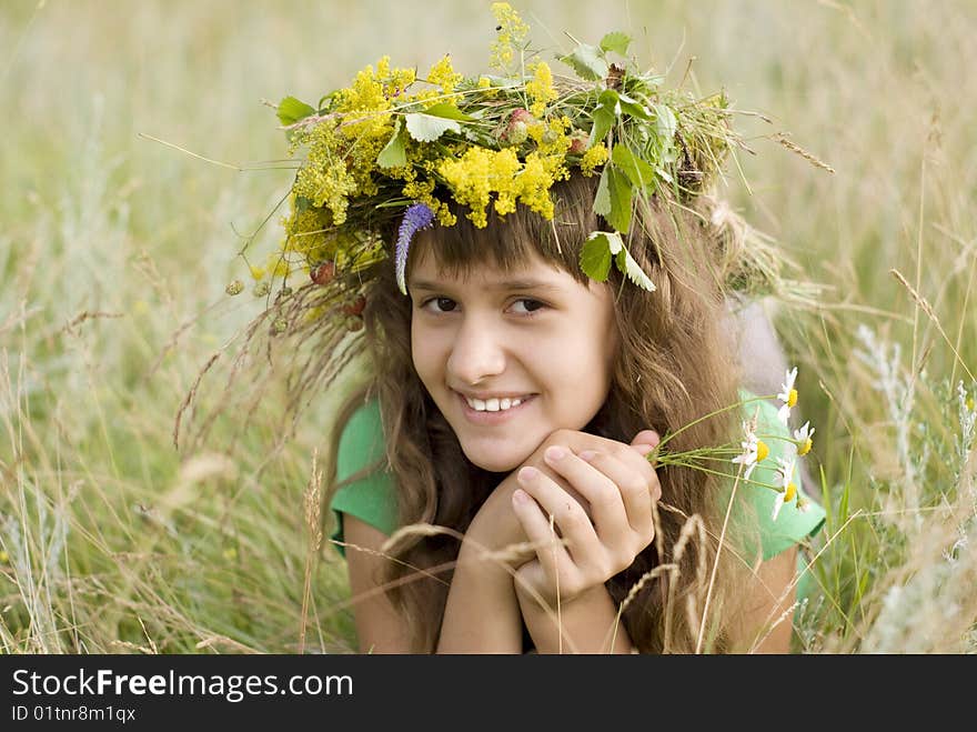 A young girl lies on a meadow. A young girl lies on a meadow