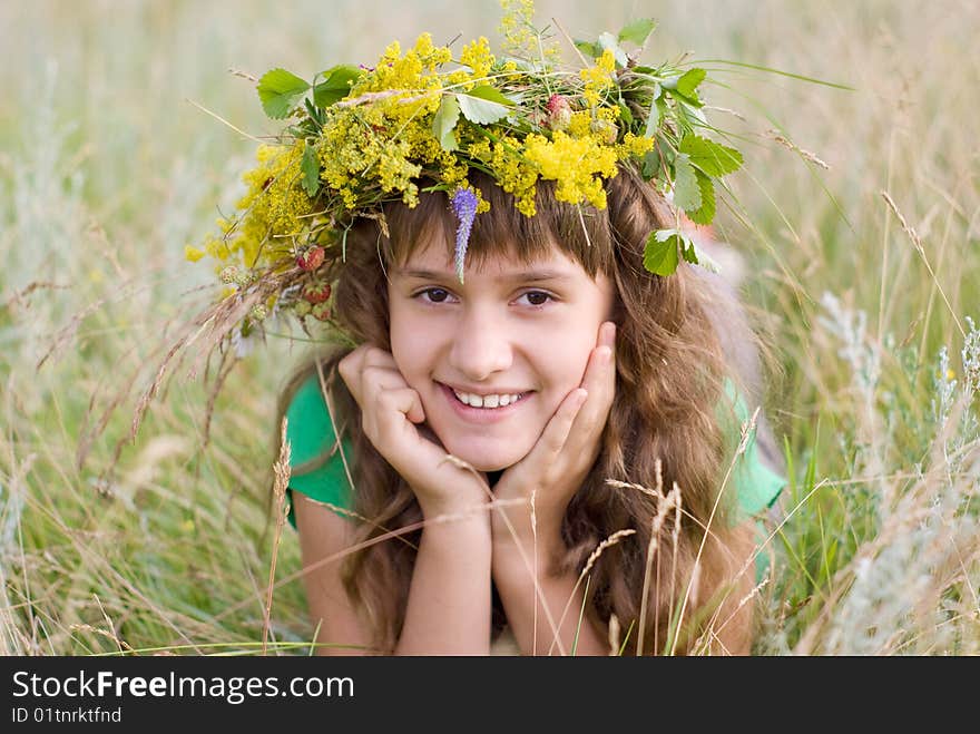 A young girl lies on a meadow. A young girl lies on a meadow