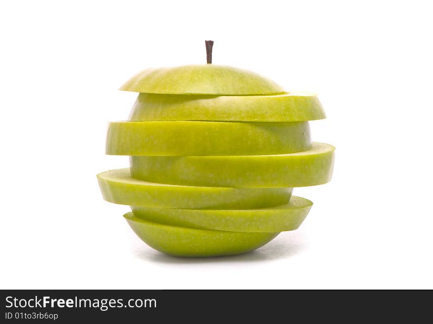 Sliced green apple on studio white