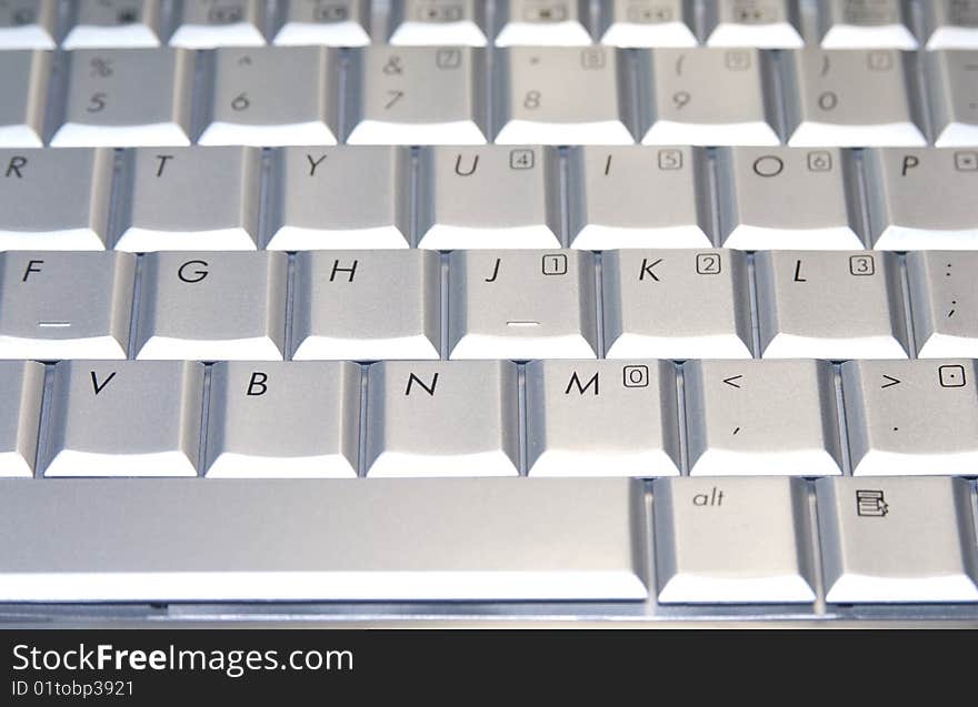 Grey keyboard of a laptop. Grey keyboard of a laptop.