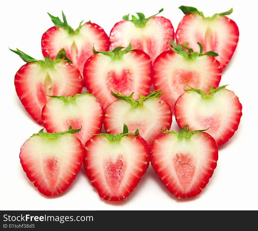 Sliced strawberries isolated in white