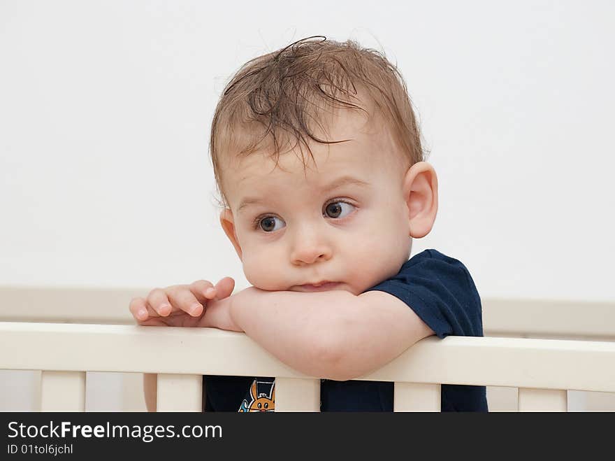 1 year old baby gazing in an invisible spot, while thinking about his future. 1 year old baby gazing in an invisible spot, while thinking about his future.