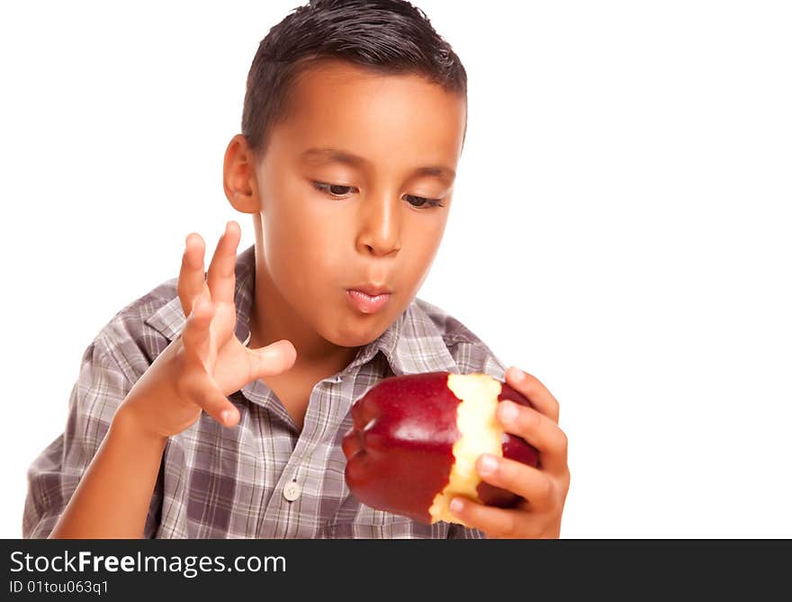 Adorable Hispanic Boy Eating a Large Red Apple Isolated on a White Background.