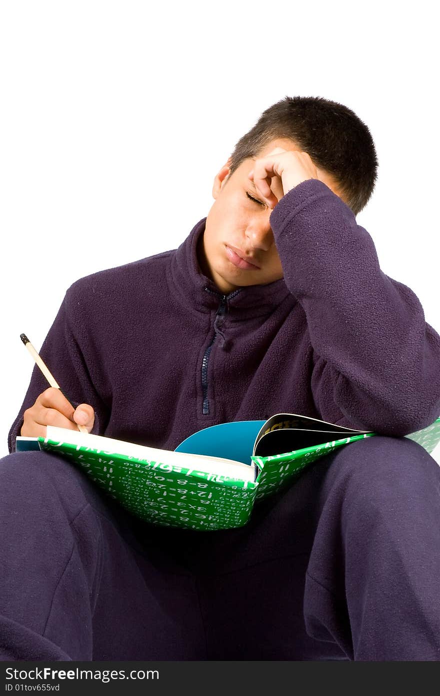 Pakistan schoolboy is tired making homework isolated on white