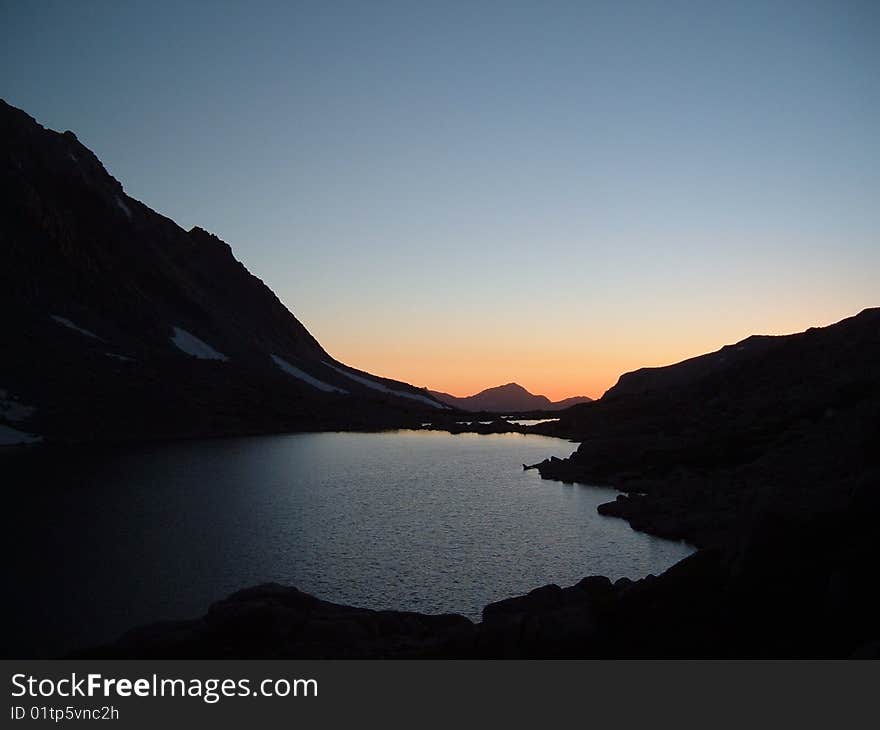 A peaceful evening near a high mountain lake, just after sunset . A peaceful evening near a high mountain lake, just after sunset .