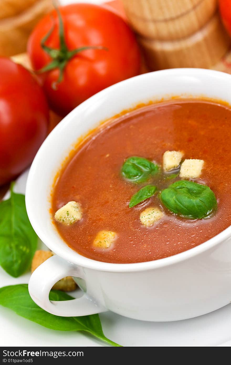 Tomato soup in white bowl