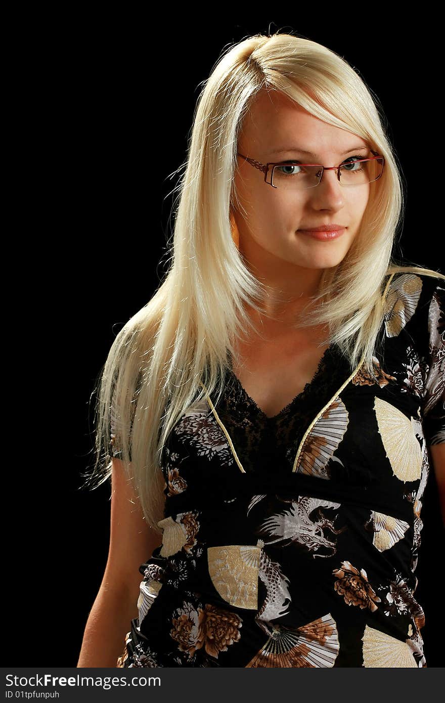 A young attractive woman, isolated on black background