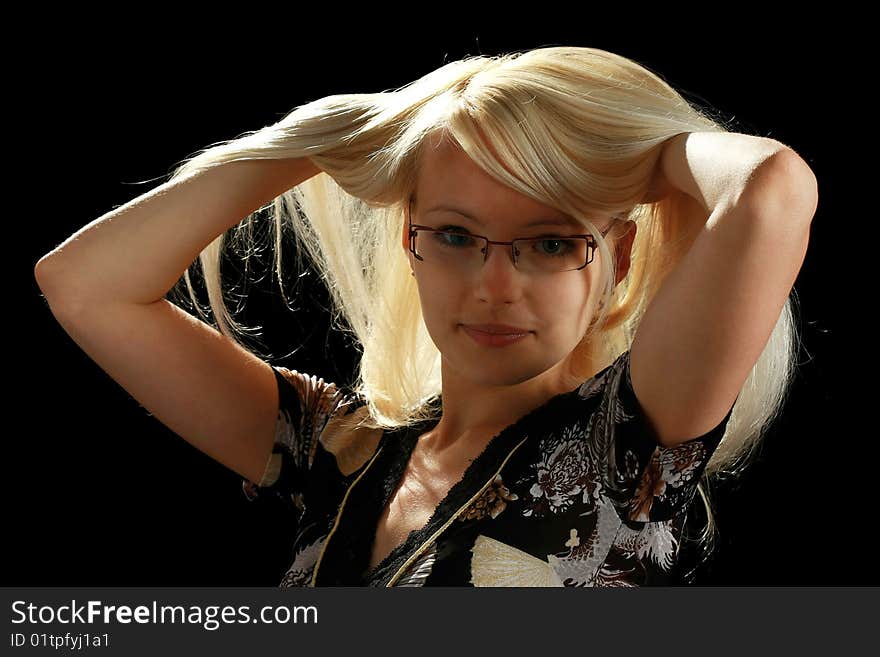 A young attractive woman, isolated on black background