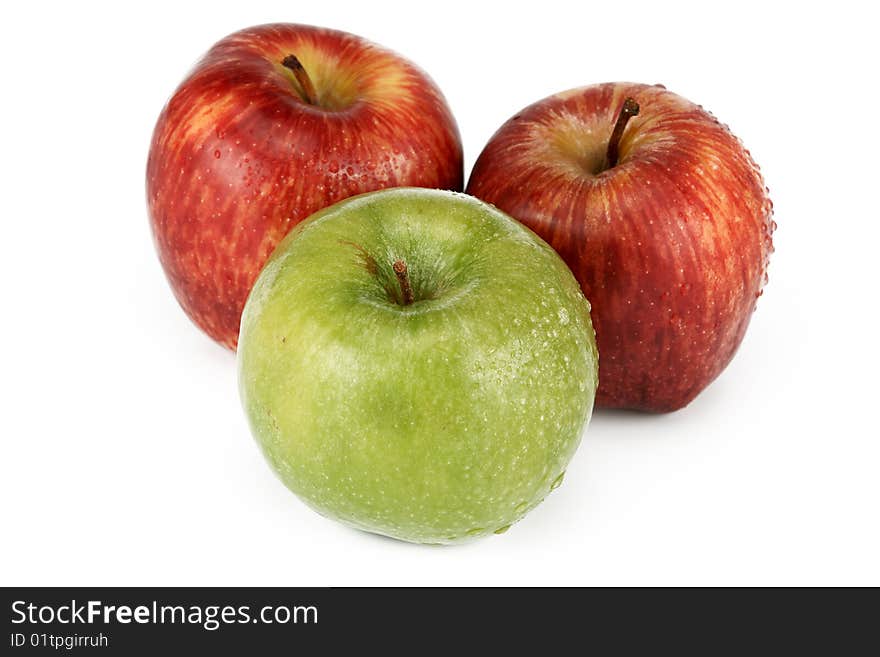 Three apples are photographed on a white background. Three apples are photographed on a white background