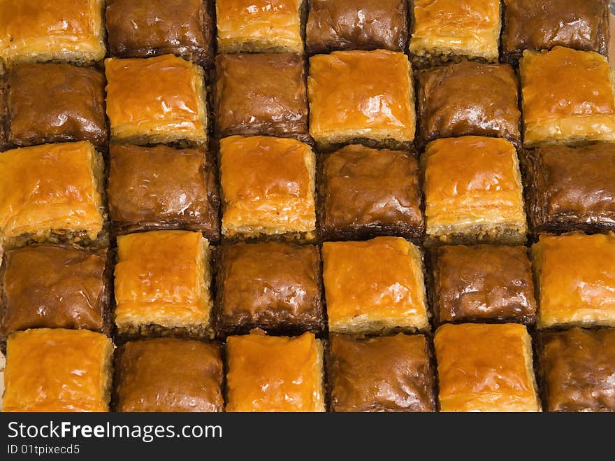 The baklava (a dessert made of thin pastry, nuts, and honey)