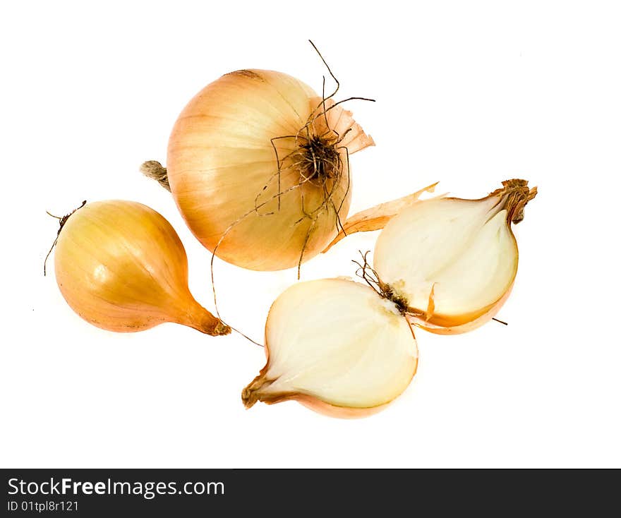 Onions in a golden peel on a white background