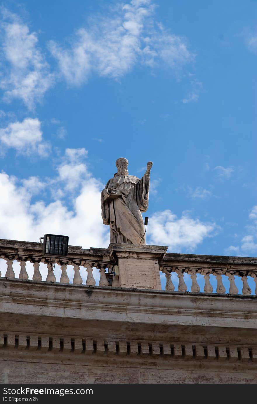 Religious Catholicism sculpture on roof against blue sky. Religious Catholicism sculpture on roof against blue sky